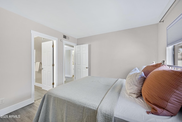 616 S Hardy Dr Unit 203, Tempe, AZ 85281 - bedroom featuring light wood-type flooring and baseboards