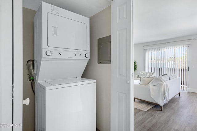 616 S Hardy Dr Unit 203, Tempe, AZ 85281 - laundry room with stacked washer and clothes dryer and wood finished floors