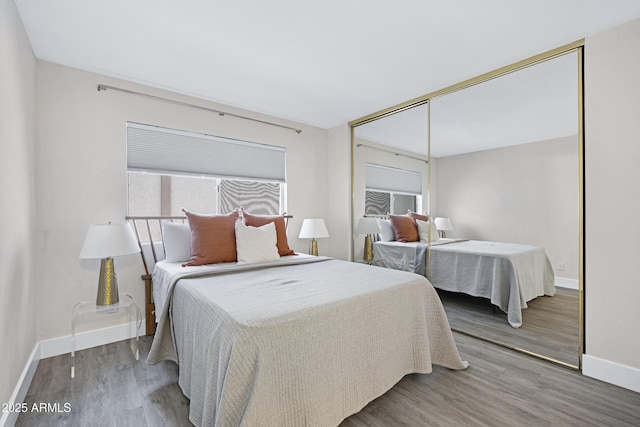 616 S Hardy Dr Unit 203, Tempe, AZ 85281 - bedroom featuring wood finished floors and a closet
