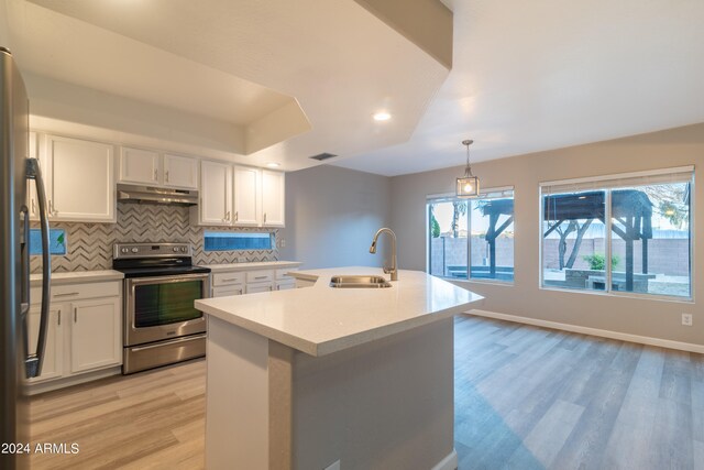 kitchen with sink, white cabinetry, stainless steel appliances, and light wood-type flooring