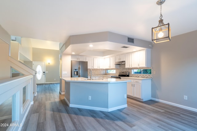 kitchen with white cabinetry, stainless steel appliances, tasteful backsplash, dark hardwood / wood-style flooring, and pendant lighting