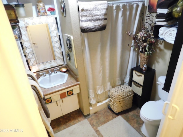 full bathroom with toilet, vanity, and a shower with curtain