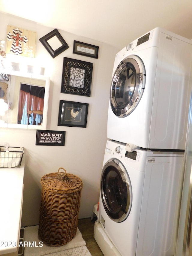 laundry area featuring laundry area and stacked washing maching and dryer