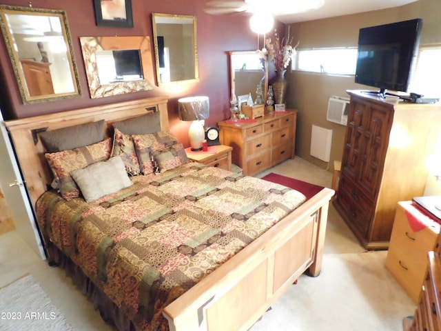 bedroom featuring a wall mounted air conditioner