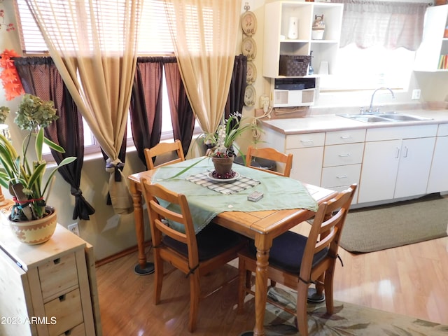 dining room with light wood-style flooring