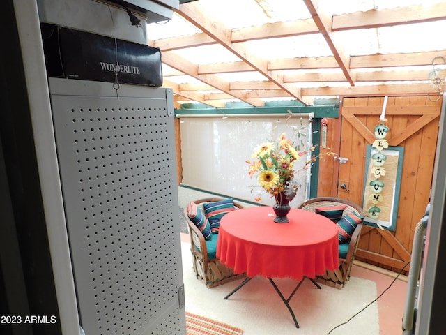 dining area with wood walls