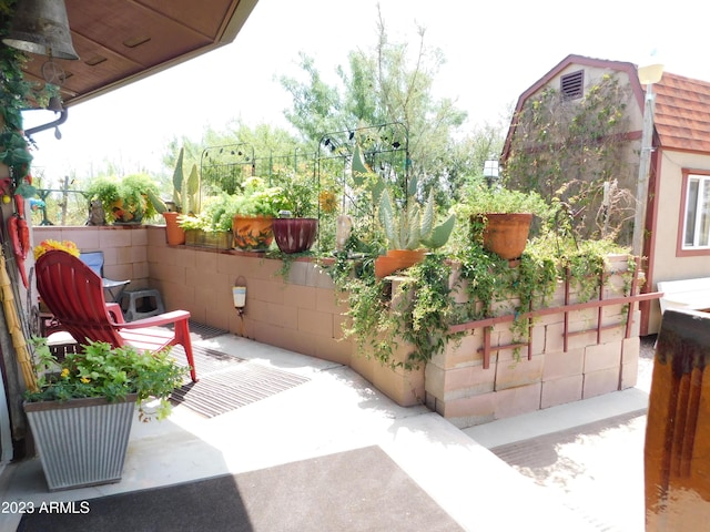 view of patio featuring fence