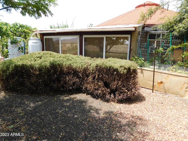 view of property exterior with a vegetable garden