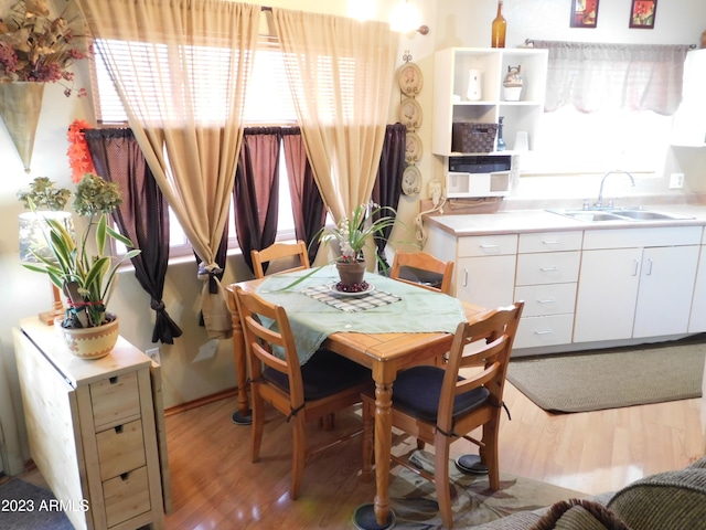 dining space with light wood-style floors