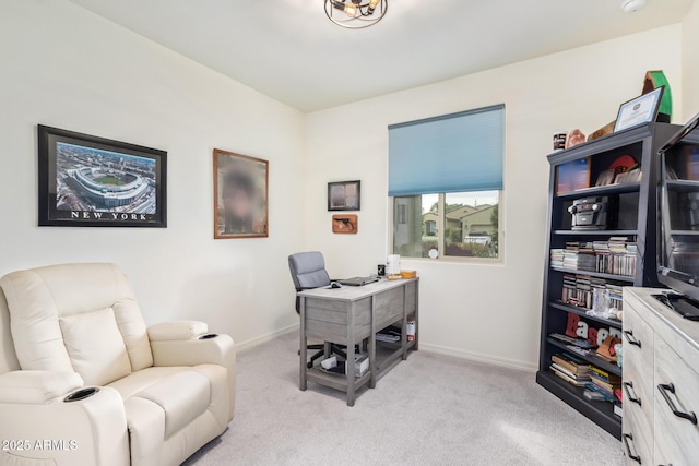 home office with light carpet and baseboards