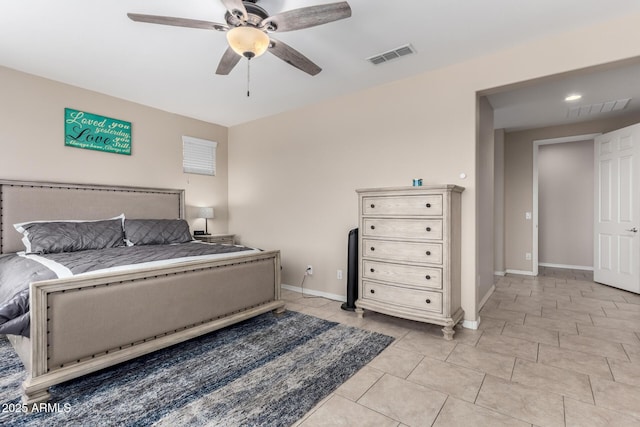 bedroom featuring light tile patterned floors, visible vents, baseboards, and ceiling fan