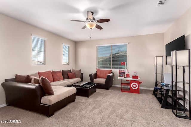 carpeted living room with visible vents, ceiling fan, and baseboards