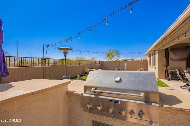 view of patio featuring grilling area and a fenced backyard