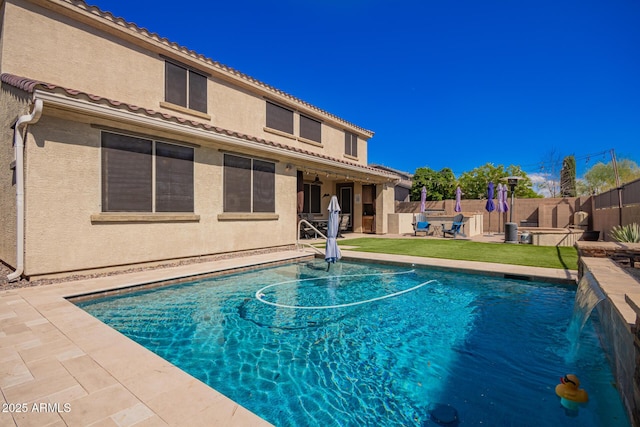 view of swimming pool with a patio area, a fenced in pool, and a fenced backyard