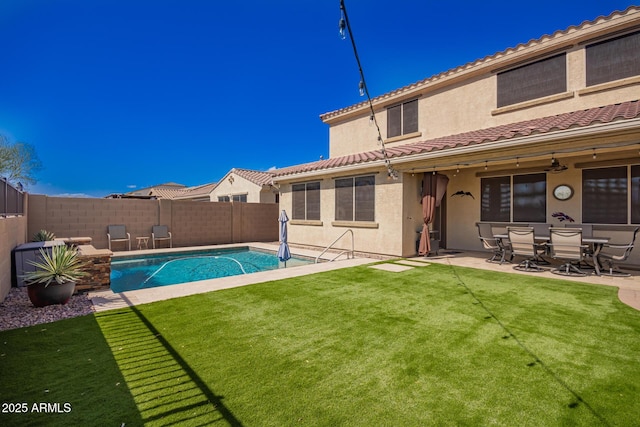 view of pool with a patio, a fenced in pool, a fenced backyard, and a lawn