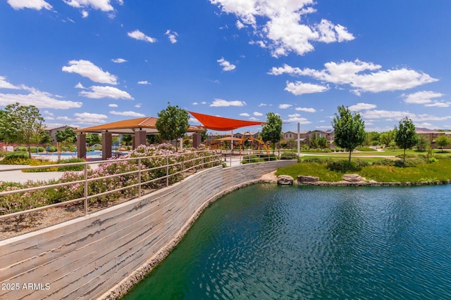 view of swimming pool with a gazebo and a water view