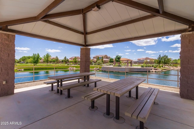 view of patio / terrace with a gazebo and a water view