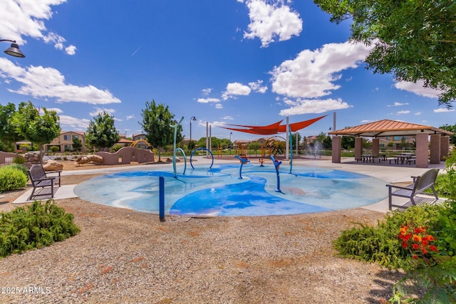 view of swimming pool featuring a gazebo and playground community