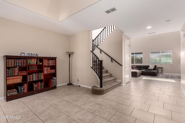 interior space with visible vents, baseboards, and tile patterned flooring