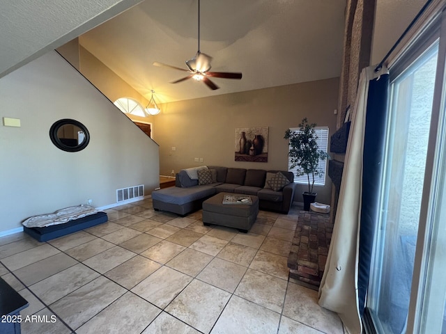19943 N 77th Ave, Glendale, AZ 85308 - living area with vaulted ceiling, light tile patterned flooring, ceiling fan, and healthy amount of natural light