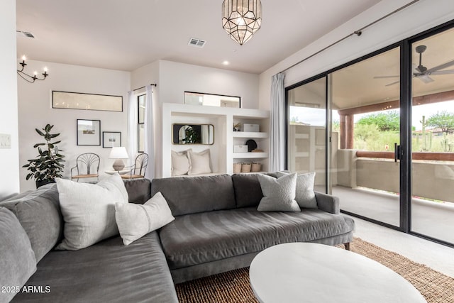 12642 N Mountainside Dr Unit B, Fountain Hills, AZ 85268 - carpeted living room with a chandelier and ceiling fan
