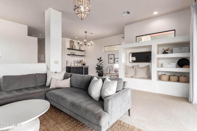 12642 N Mountainside Dr Unit B, Fountain Hills, AZ 85268 - living area with light carpet, a chandelier, recessed lighting, and built in shelves
