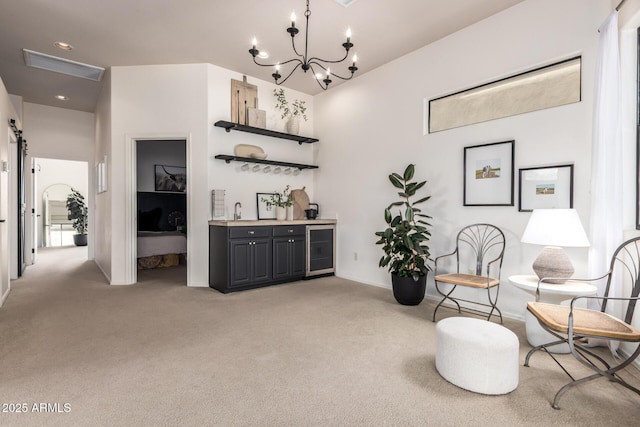 12642 N Mountainside Dr Unit B, Fountain Hills, AZ 85268 - living area featuring wet bar, light colored carpet, wine cooler, and a chandelier