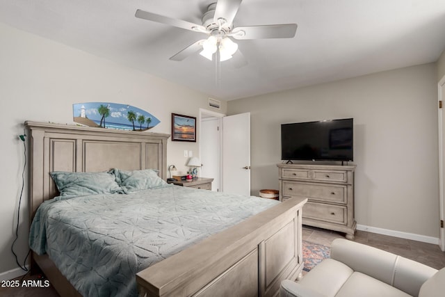 bedroom featuring baseboards and a ceiling fan