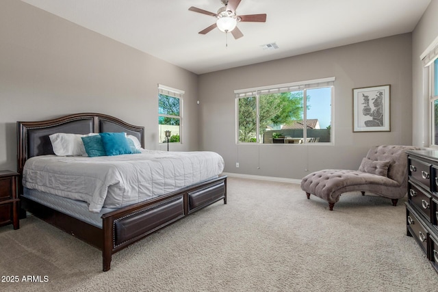 carpeted bedroom featuring baseboards and a ceiling fan