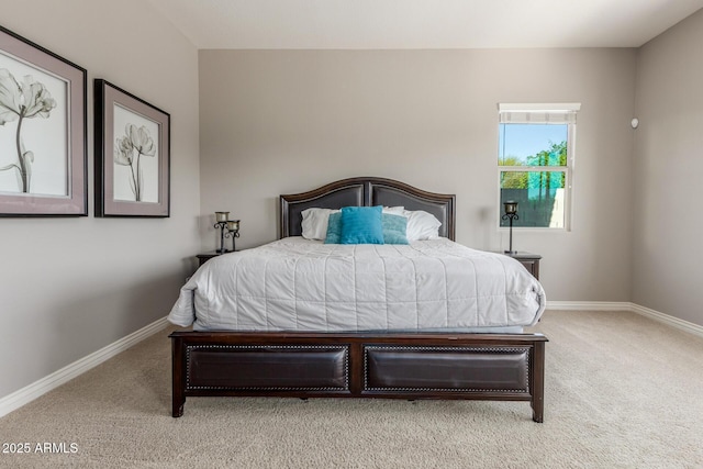 carpeted bedroom featuring baseboards