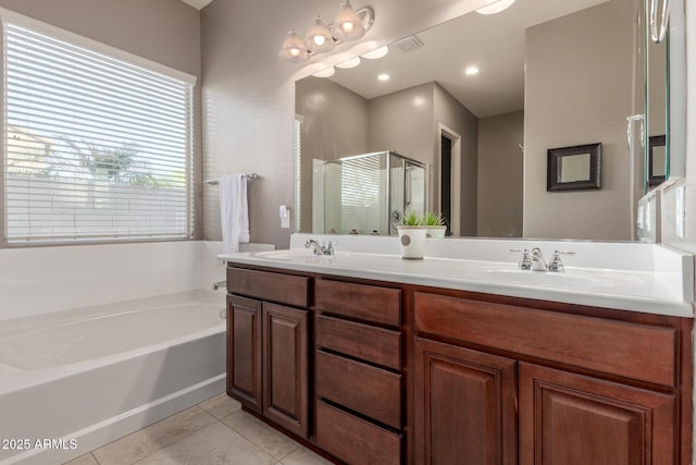 bathroom with a bath, tile patterned flooring, double vanity, and a shower stall