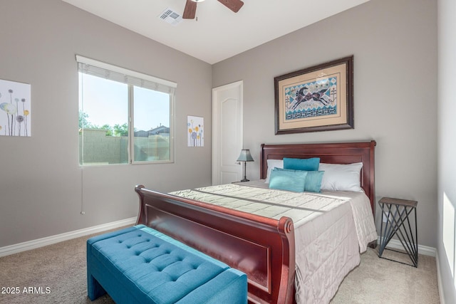 carpeted bedroom featuring baseboards and a ceiling fan