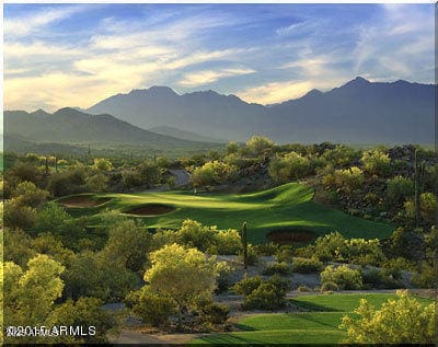 view of property's community with golf course view and a mountain view