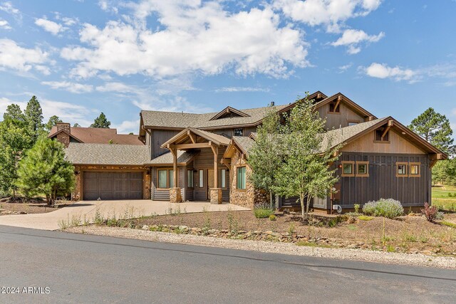 craftsman-style home with a garage