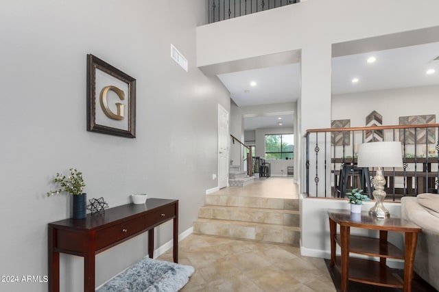 foyer featuring a high ceiling