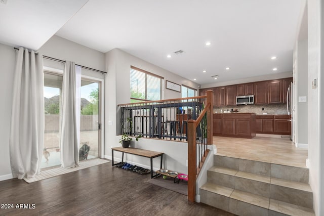 stairs featuring wood-type flooring