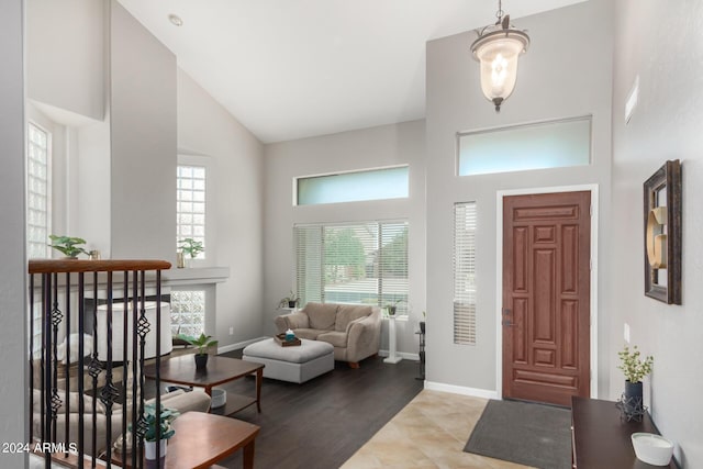 foyer featuring high vaulted ceiling