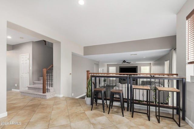 kitchen featuring ceiling fan and light tile patterned floors