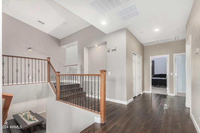 corridor featuring dark hardwood / wood-style flooring