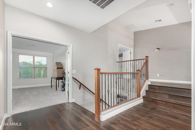 staircase with hardwood / wood-style flooring