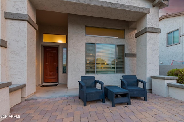 entrance to property with a patio