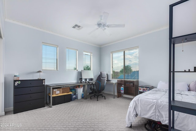 carpeted bedroom with ornamental molding and ceiling fan