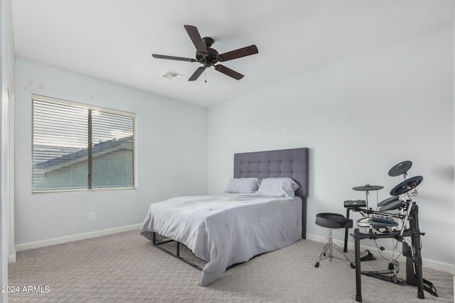 bedroom featuring light carpet and ceiling fan