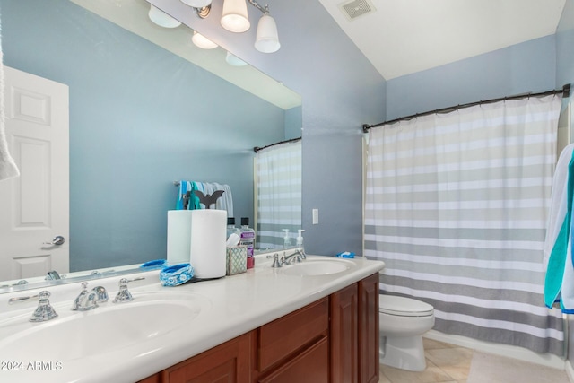 bathroom with vanity, tile patterned floors, and toilet