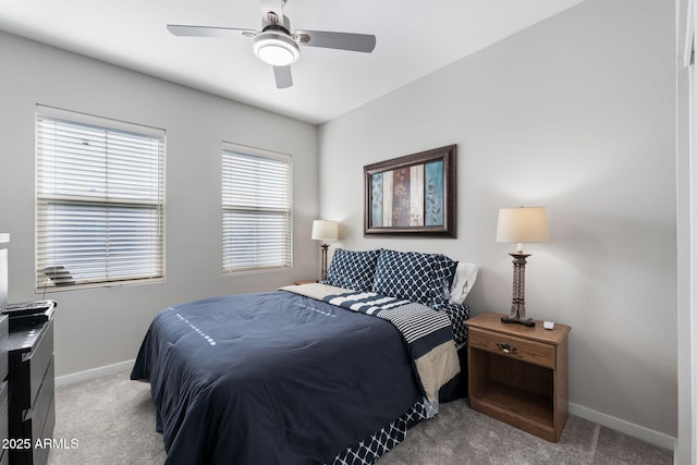 bedroom with light carpet and ceiling fan