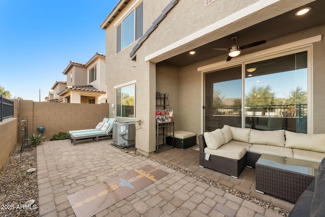 view of patio / terrace featuring ceiling fan, an outdoor living space, and central air condition unit