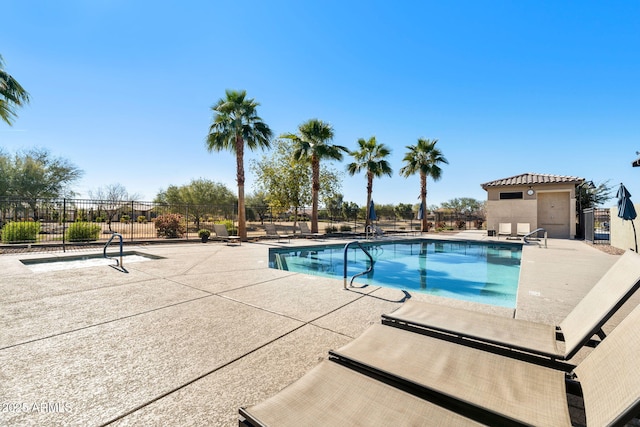 view of swimming pool with a patio area