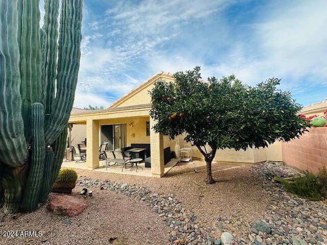 rear view of house featuring a patio