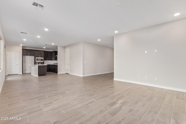 unfurnished living room with light wood-type flooring