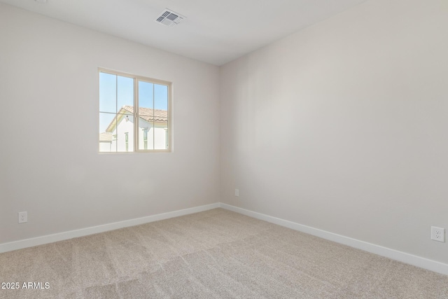 empty room with light colored carpet